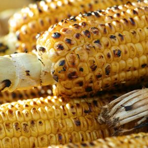 yellow corn on brown wooden table