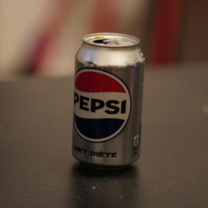 A can of pepsi sitting on top of a table